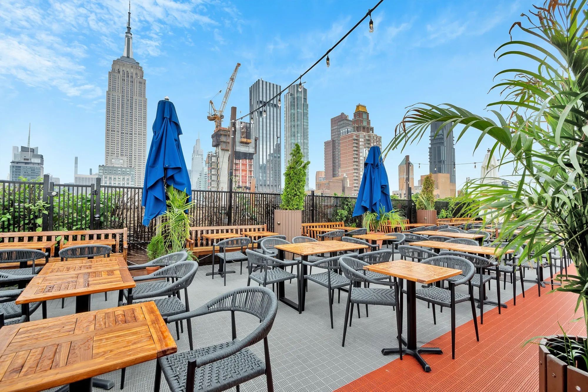 A sunny outdoor bar in Midtown with Empire State views: 230 5th Rooftop Bar image 2