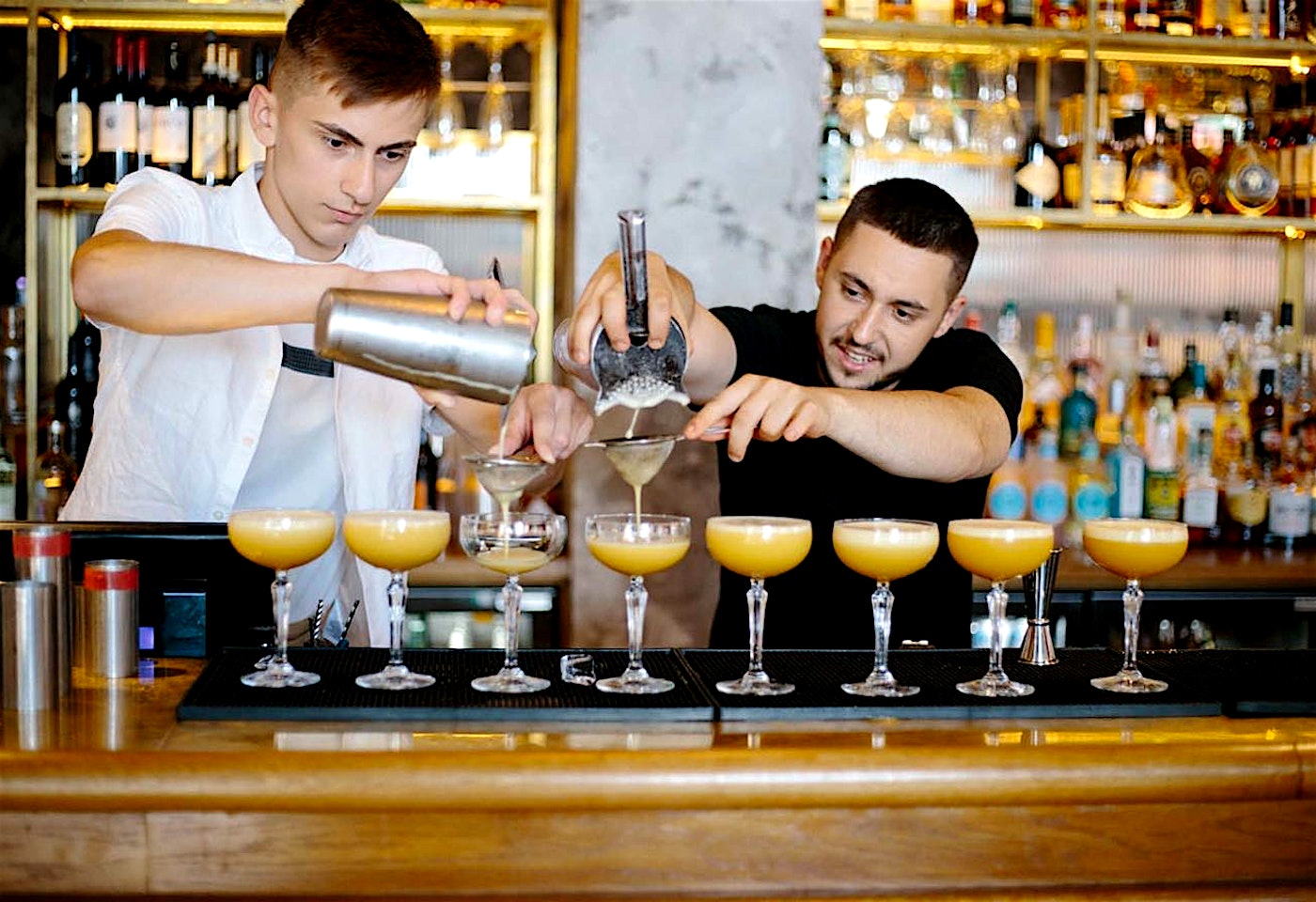 Bartenders making cocktails at Fleets, a bar in the St Pauls district of London