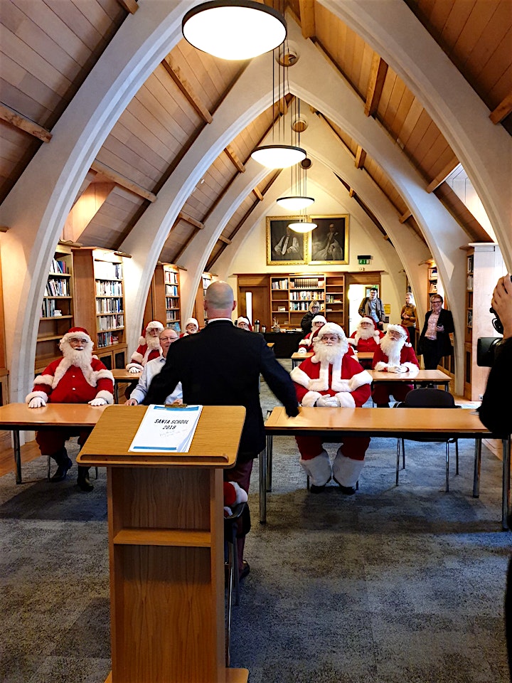 a group of santas at the meeting room at the garry weston library at southwark cathedral