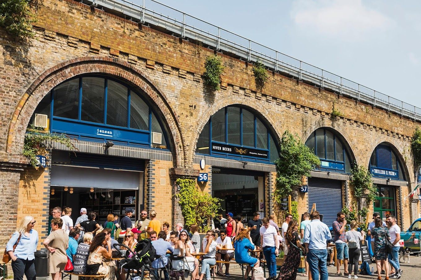 people seated outside jensens at the bermondsey distillery in bermondsey london