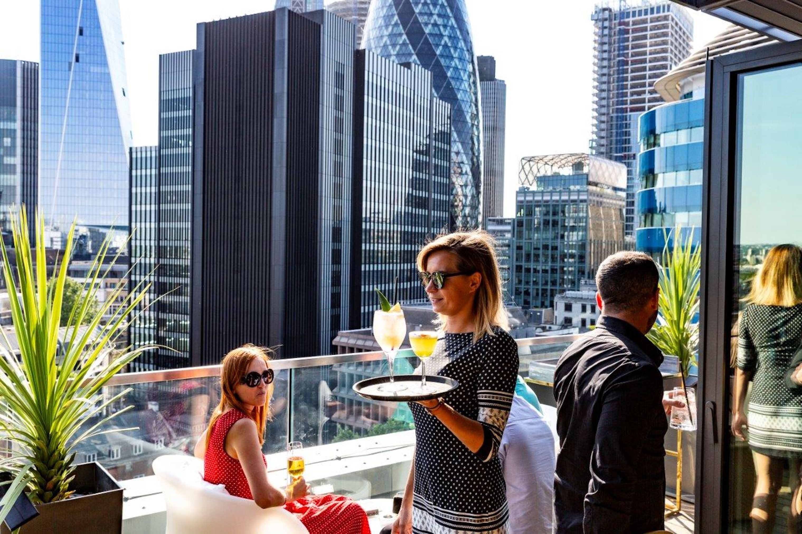 people at jin bo law city of london rooftop bar