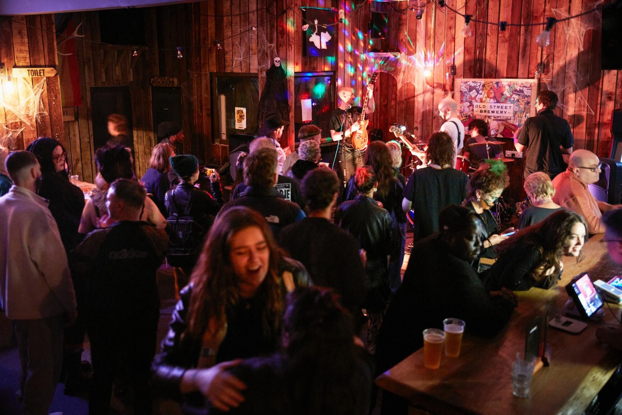 people at old street brewery in hackney wick london