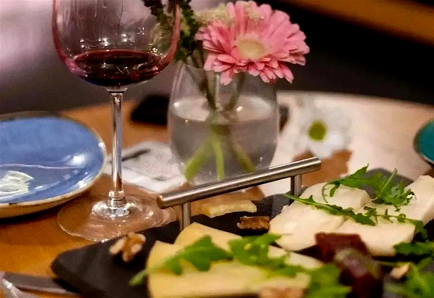 glass of red wine and cheeseboard at pedros wine bar in bermondsey london