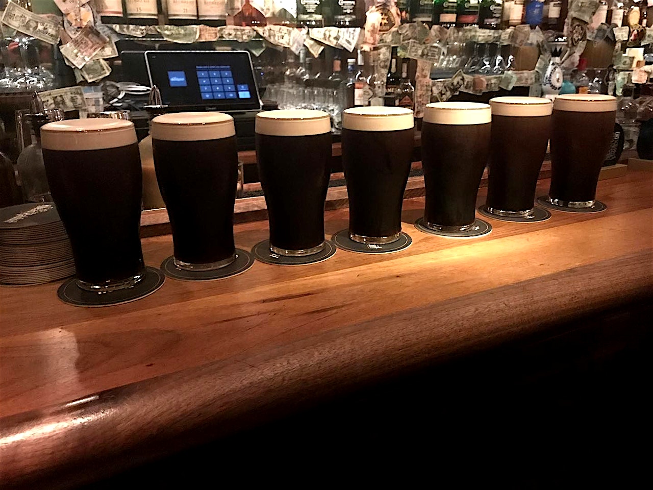 pints of guinness at the four faced liar west village bar nyc