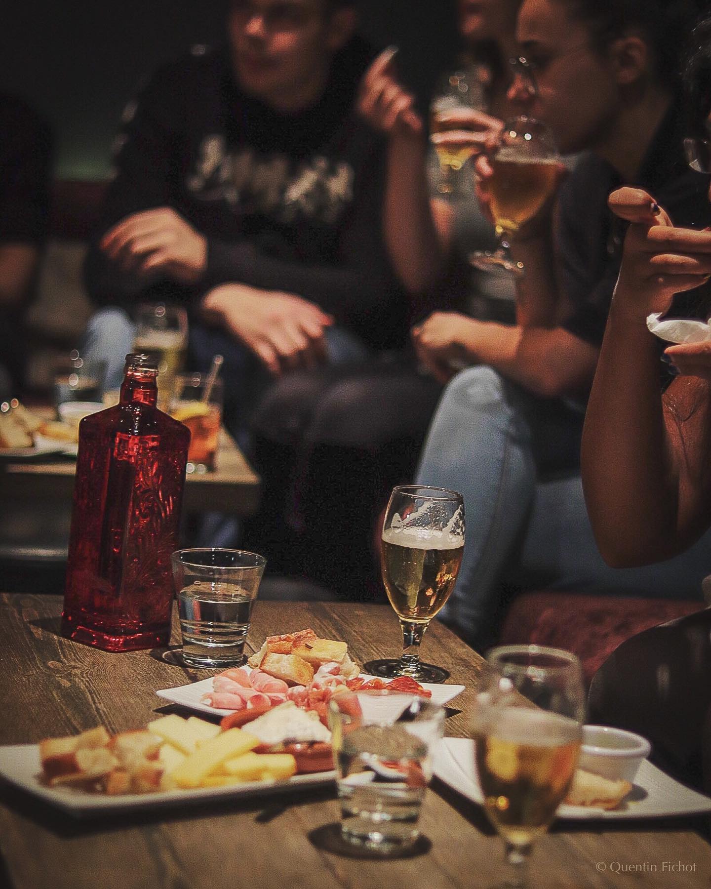 people drinking and eating at the London Bridge bar The Hide Bar