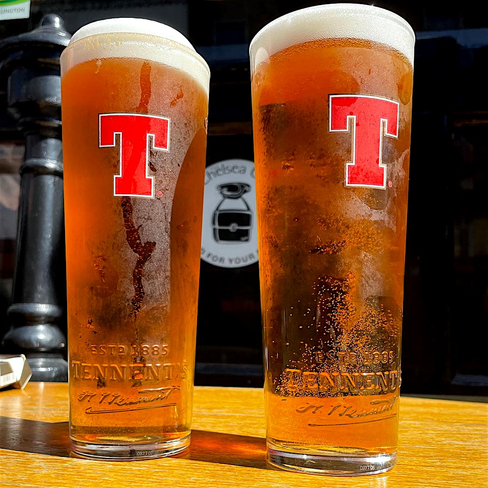 two pints of tennents lager the scottish stores kings cross pub in london