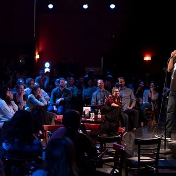People enjoying a show at The Stand, a comedy club in NYC. 